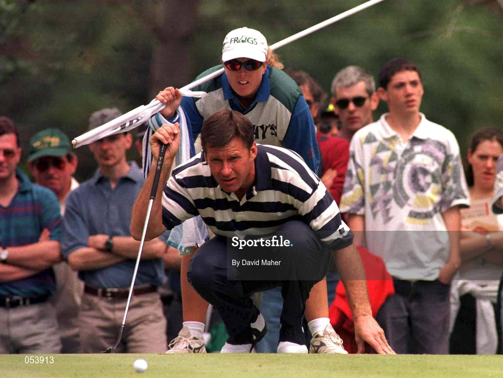 5 July 1997; Nick Faldo of England studies a putt on the first green with the help of his caddy Fanny Senesen during the third round of the Murphy's Irish Open Golf Championship at Druid's Glen Golf Course in Wicklow. Photo by David Maher/Sportsfile