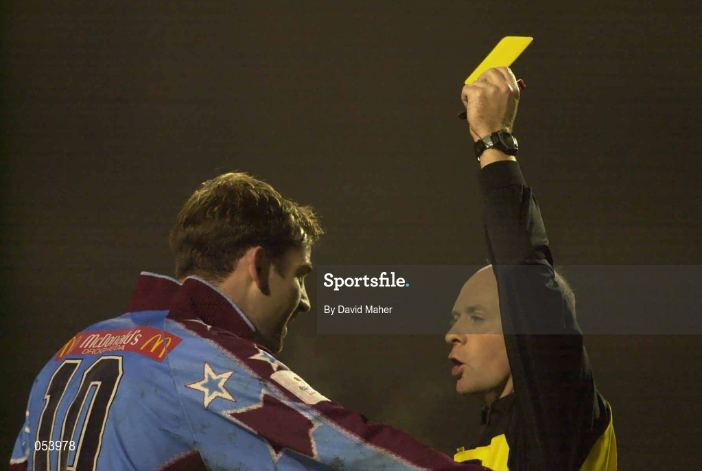 5 January 2001; Referee John Stacey shows Trevor Vaughan of Drogheda United a yellow card during the FAI Harp Lager Cup Second Round match between Bohemians and Drogheda United at Dalymount Park in Dublin. Photo by David Maher/Sportsfile