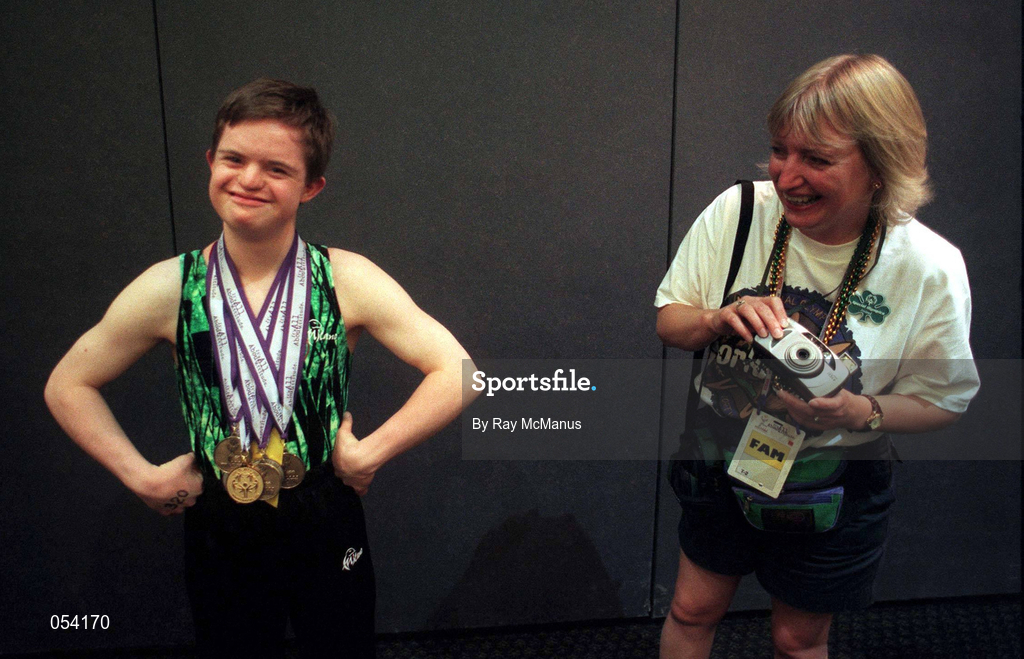 2 July 1999; Gymnaist Adam Morrison from Newtownards, Down, who won six medals, one Gold, two Silver and three Bronze proudly displays his medals, watched by his mother Annabelle after the presentation of prizes at the 1999 Special Olympics World Summer Games in Raleigh, North Carolina, USA. Photo by Ray McManus/Sportsfile