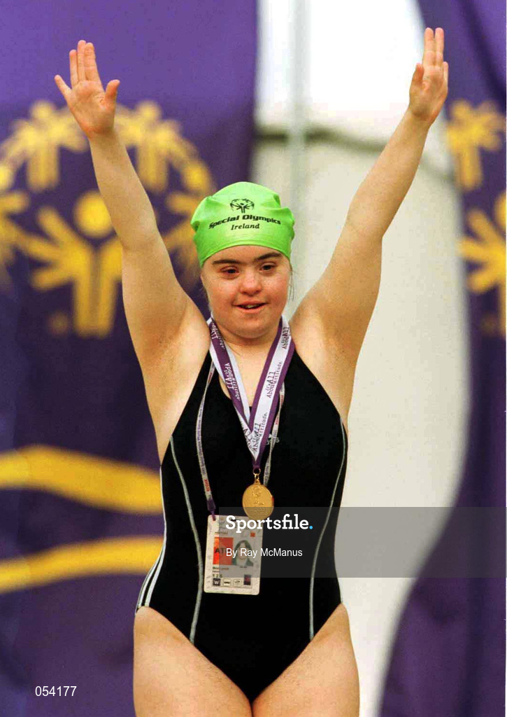 30 June 1999; Brid Lynch from Dublin celebrates with her Gold medal after she won the 100 meters Freestyle during the 1999 Special Olympics World Summer Games in Raleigh, North Carolina, USA. Photo by Ray McManus/Sportsfile