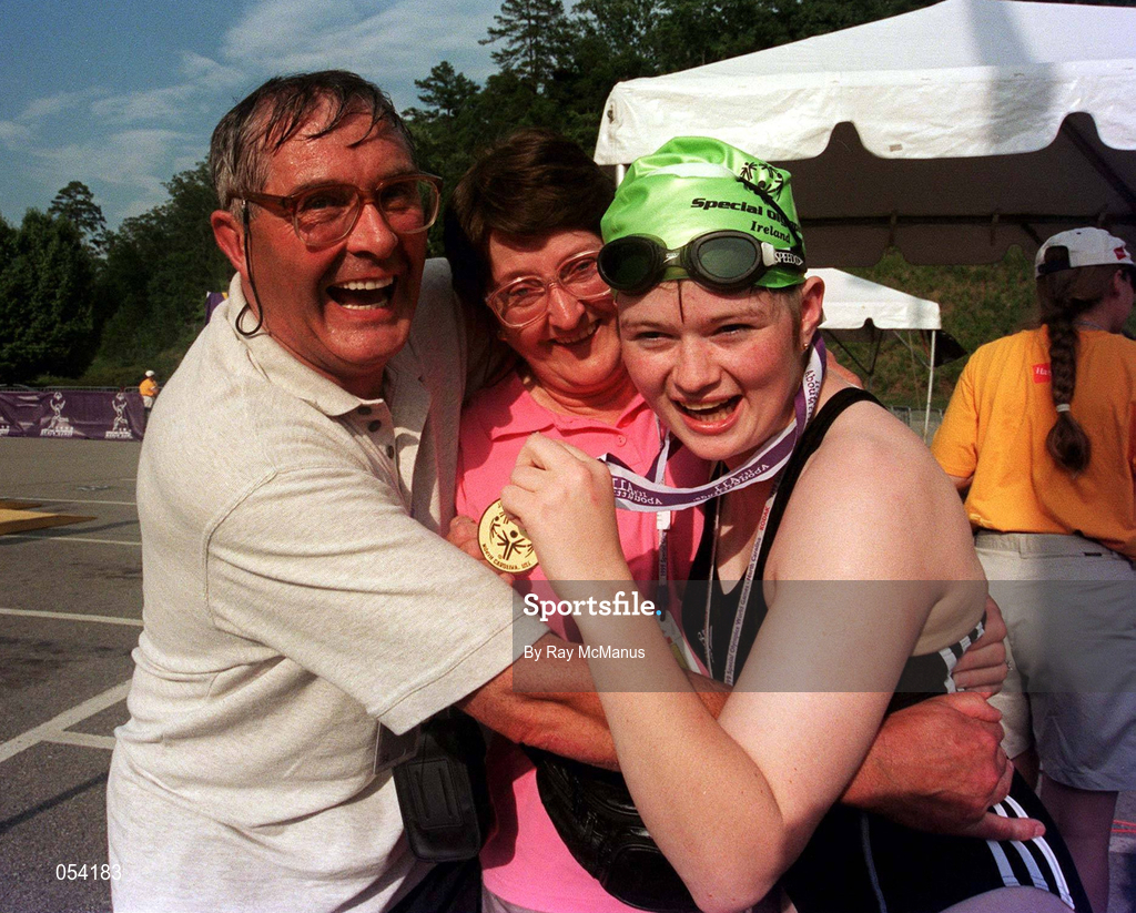 30 June 1999; Caitriona Ryan from Rathlee,  Sligo and her parents Eugene and Anna with Caitriona's Gold medal after winning the 25 meters Freestyle during the 1999 Special Olympics World Summer Games in Raleigh, North Carolina, USA. Photo by Ray McManus/Sportsfile