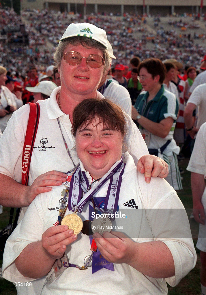4 July 1999; Special Olympian Denise Fegan, Lenaderg, Down who won Gold and Silver medals in Athletics pictured with Athletics coach Liz Henry at the Closing Ceremony of the 1999 Special Olympics World Summer Games in Raleigh, North Carolina. Photo by Ray McManus/Sportsfile