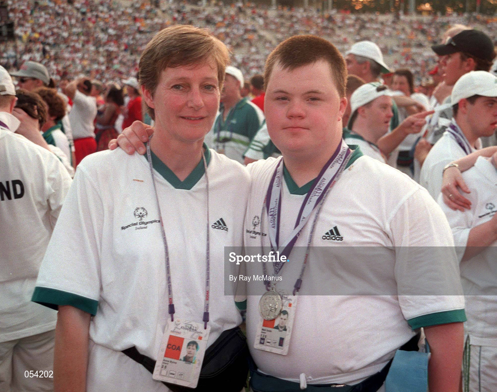 4 July 1999; Special Olympian Mark Smith from Maynooth, Kildare who won a Silver medal in swimming with table tennis coach Anna Byrne at the Closing Ceremony of the 1999 Special Olympics World Summer Games in Raleigh, North Carolina, USA. Photo by Ray McManus/Sportsfile