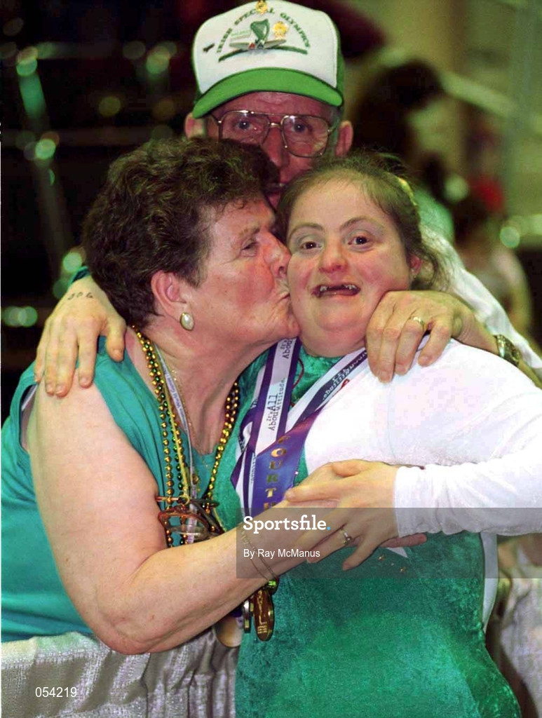 2 July 1999; Paula Carroll from Coolock, Dublin, is congratulated by her mother Nancy and father Johnny after the presentation to Paula of four medals, one Gold, two Silver and a Bronze for Gymnastics at the 1999 Special Olympics World Summer Games in Raleigh, North Carolina, USA. Photo by Ray McManus/Sportsfile