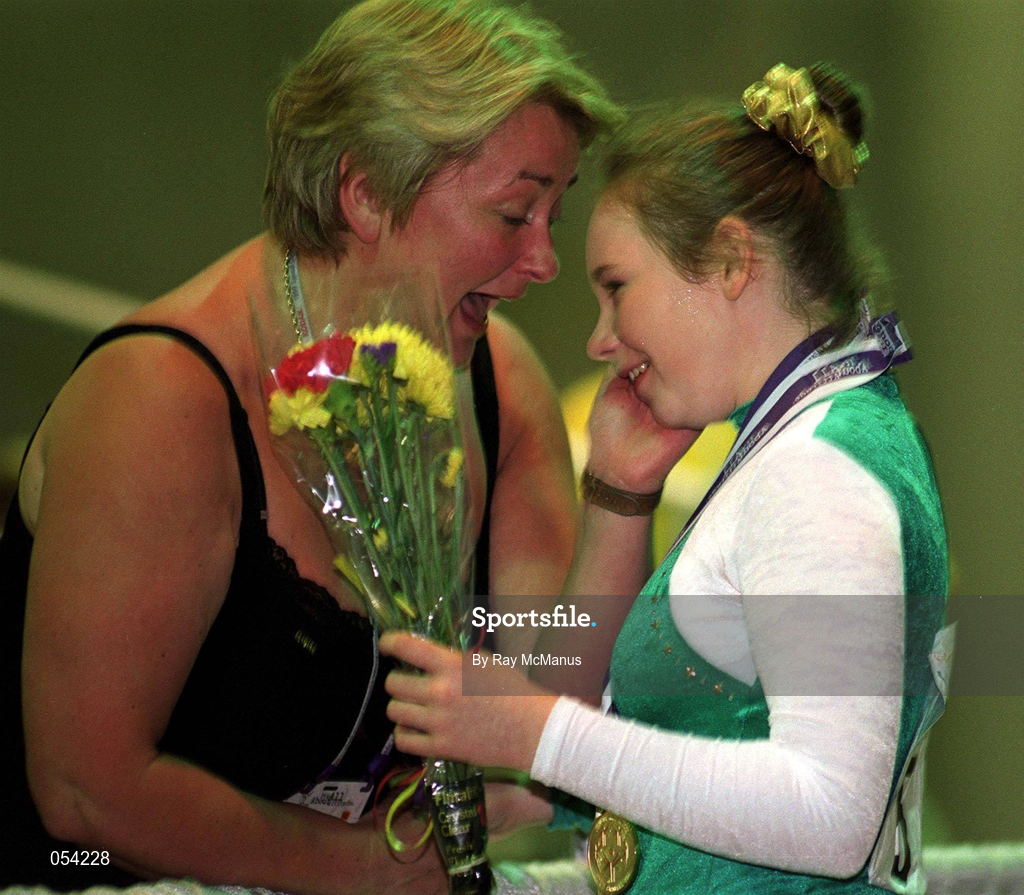 2 July 1999; Danielle Convery from Ballymena, Antrim is congratulated by her mother Virginia after the presentation of five medals to Danielle, two Gold, two Silver and a Bronze for Gymnastics during the 1999 Special Olympics World Summer Games in Raleigh, North Carolina, USA. Photo by Ray McManus/Sportsfile