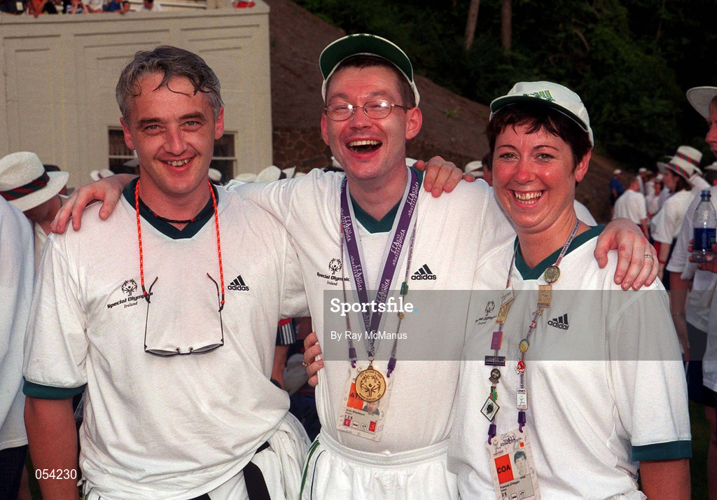 4 July 1999; Special Olympian John Blackburn from Newtown, Co Wexford who won a Gold Medal in the Shot Put pictured with swimming coaches Jimmy Goodall, left, from Enniscorthy,  Wexford and Frances O'Hagan from Ferns, Wexford at the Closing Ceremony of the 1999 Special Olympics World Summer Games in Raleigh, North Carolina, USA. Photo by Ray McManus/Sportsfile