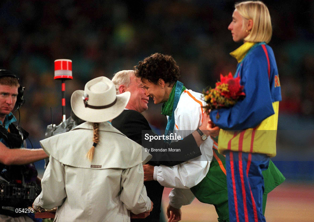 25 September 2000; Sonia O'Sullivan of Ireland is presented with her silver medal by Pat Hickey, President of the Olympic Council of Ireland, alongside gold medallist, Gabriela Szabo of Romania, during the medal ceremony following the Women's 5000m Final at Stadium Australia in Sydney Olympic Park, Homebush Bay, Sydney, Australia.  Photo by Brendan Moran/Sportsfile