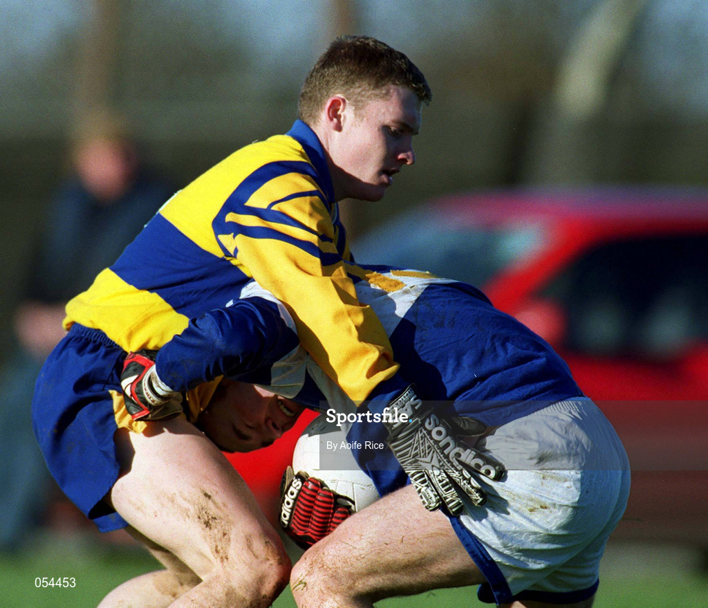 14 January 2001; Paul Dunne of Laois is tackled by Enda Ledwith of Longford during the O'Byrne Cup First Round match between Longford and Laois at Pearse Park in Longford. Photo by Aoife Rice/Sportsfile