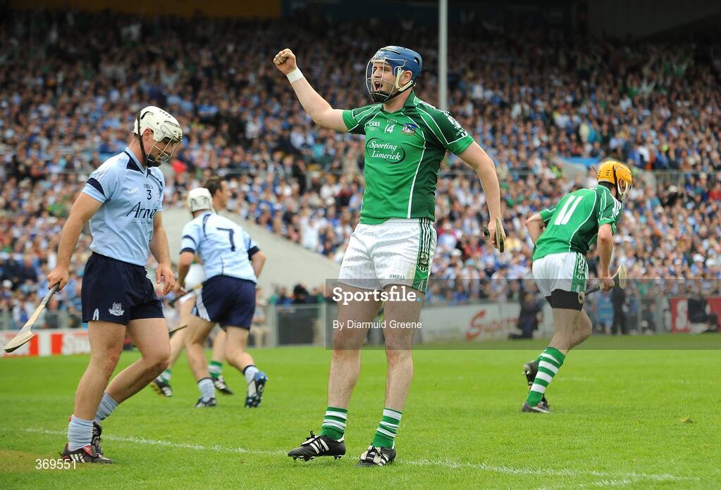 26 July 2009; Limerick's Paudie McNamara, celebrates a late Limerick score as Dublin's Tomas Brady looks on. GAA All-Ireland Senior Hurling Championship Quarter-Final, Dublin v Limerick, Semple Stadium, Thurles, Co. Tipperary. Picture credit: Diarmuid Greene / SPORTSFILE