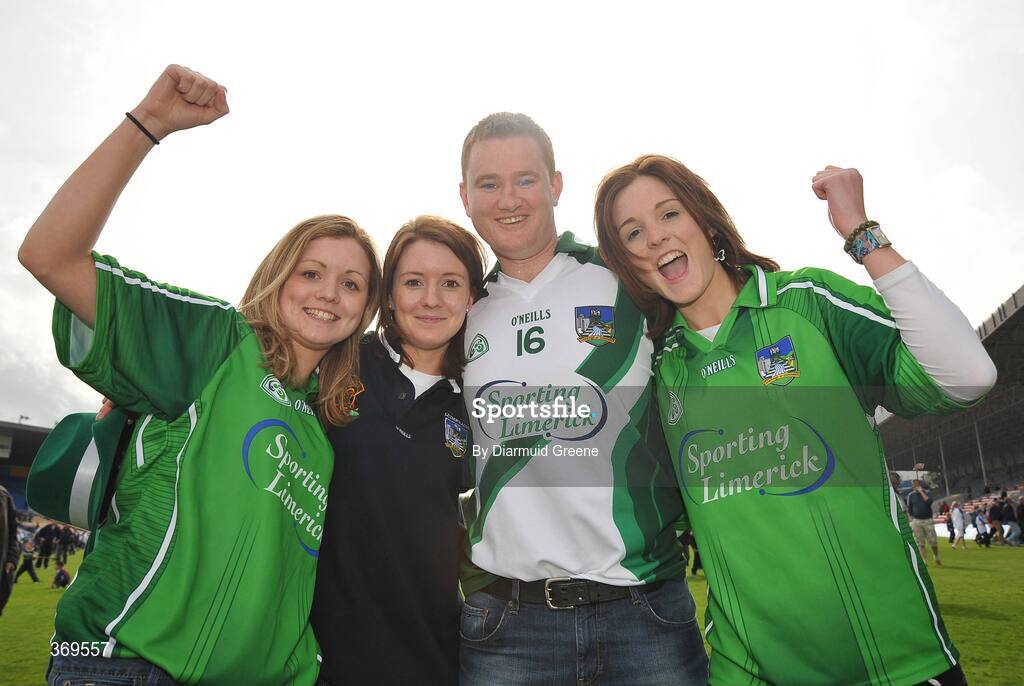 26 July 2009; Limerick supporters, from left to right, Niamh Lanigan, Maree Lanigan, Jerome Curtin and Ruth Lanigan celebrate on the pitch after victory over Dublin. GAA All-Ireland Senior Hurling Championship Quarter-Final, Dublin v Limerick, Semple Stadium, Thurles, Co. Tipperary. Picture credit: Diarmuid Greene / SPORTSFILE
