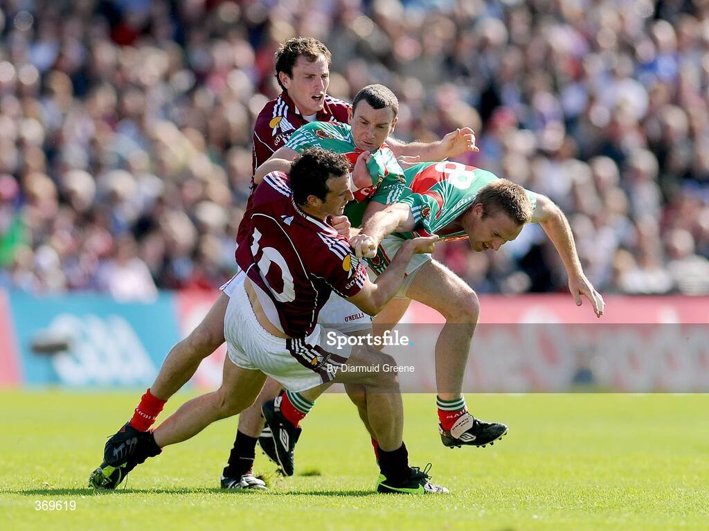 19 July 2009; Mayo's Keith Higgins, left, and David Heaney, tussle off the ball with Galway's Joe Bergin and Diarmuid Blake, no.6. GAA Football Connacht Senior Championship Final, Galway v Mayo, Pearse Stadium, Salthill, Galway. Picture credit: Diarmuid Greene / SPORTSFILE