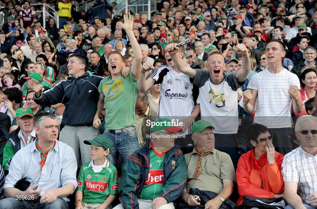 19 July 2009; Galway supporters celebrate after Michael Meehan scored a late goal to equalise the score as Mayo supporters look on. GAA Football Connacht Senior Championship Final, Galway v Mayo, Pearse Stadium, Salthill, Galway. Picture credit: Diarmuid Greene / SPORTSFILE