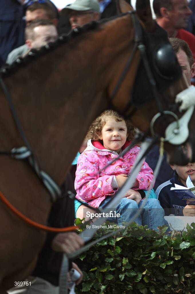 27 July 2009; Niamh Jordan, age 4, from Galway, keeps a close eye on the parade ring ahead of the Ghotel.ie & Hotelmeyrick.ie Novice Hurdle. Galway Racing Festival, Ballybrit, Galway. Picture credit: Stephen McCarthy / SPORTSFILE