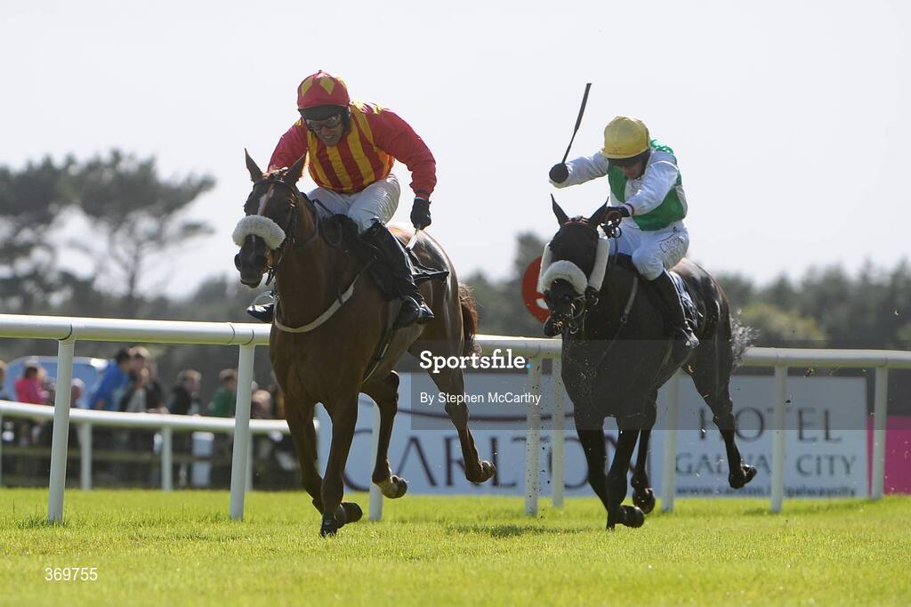 27 July 2009; No One Tells Me, with Robbie Power up, left, on their way to winning the Galwaybayhotel.com Handicap Hurdle from eventual second, Right Or Wrong, with Barry Geraghty. Galway Racing Festival, Ballybrit, Galway. Picture credit: Stephen McCarthy / SPORTSFILE