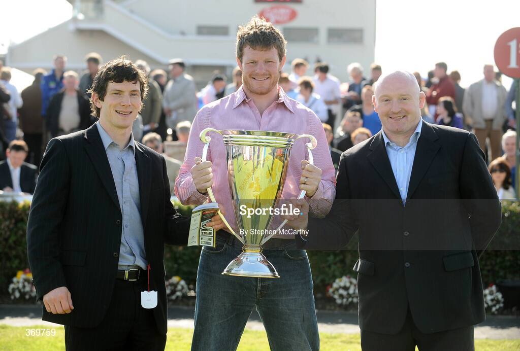 27 July 2009; Leinster rugby stars Malcolm O'Kelly, centre, and Bernard Jackman, right, with Galway footballer Micheal Meehan and the Heineken Cup. Galway Racing Festival, Ballybrit, Galway. Picture credit: Stephen McCarthy / SPORTSFILE