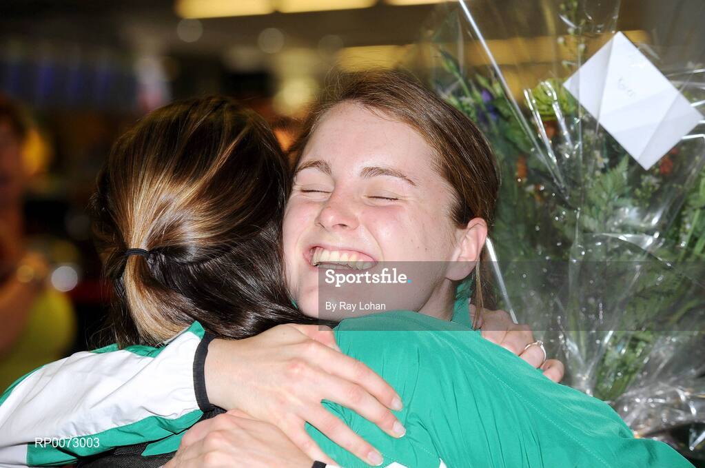 25 July 2009; Gold Medal winning European Youth Olympic athlete in the 1500m, Ciara Mageean, is congratulated by one of the team coaches, Karen Kirk, at her arrival at Dublin Airport, Dublin. Picture credit: Ray Lohan / SPORTSFILE