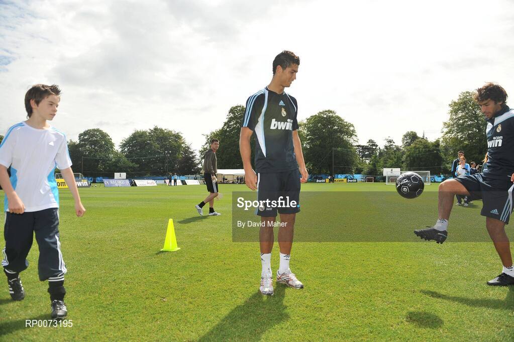 19 July 2009; Real Madrid's Cristiano Ronaldo and Raul practice their skills as Andrew Howell watches on during a special training session run by adidas and Lifestyle Sports. Real Madrid pre-season squad training, Carton House, Maynooth, Co. Kildare. Picture credit: David Maher / SPORTSFILE