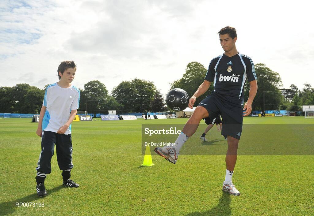 19 July 2009; Real Madrid's Cristiano Ronaldo practices his skills as Andrew Howell watches on during a special training session run by adidas and Lifestyle Sports. Real Madrid pre-season squad training, Carton House, Maynooth, Co. Kildare. Picture credit: David Maher / SPORTSFILE