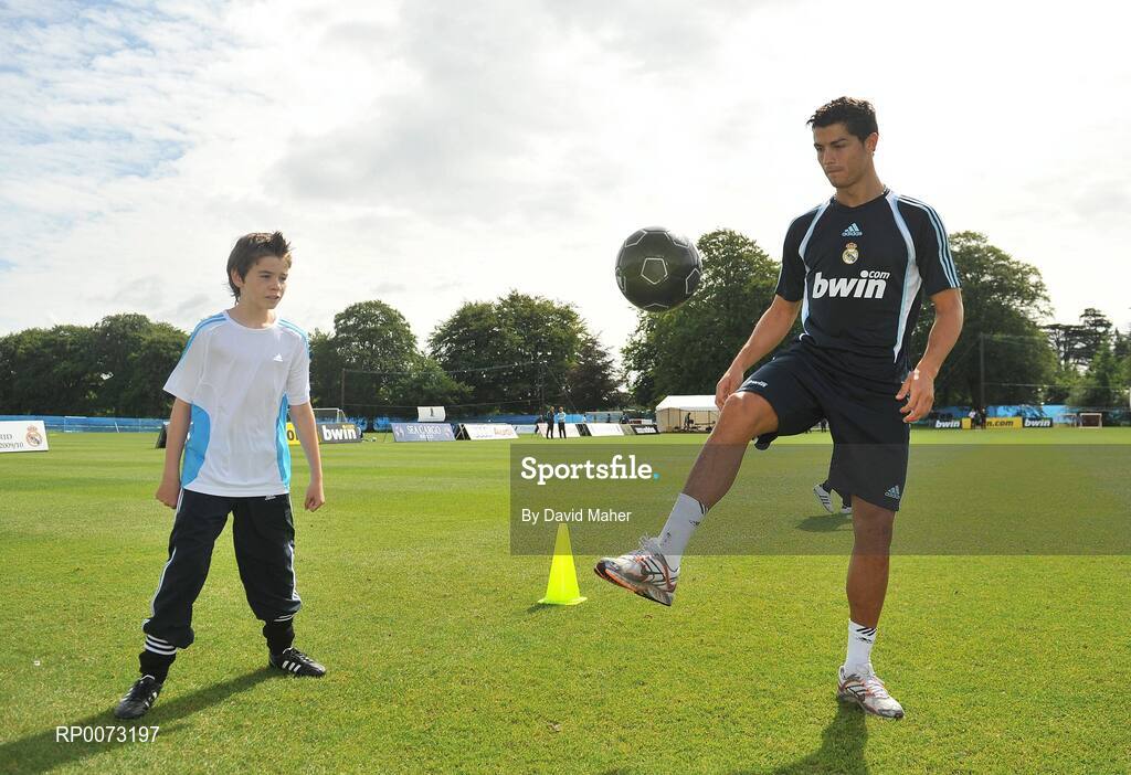 19 July 2009; Real Madrid's Cristiano Ronaldo practices his skills as Andrew Howell watches on during a special training session run by adidas and Lifestyle Sports. Real Madrid pre-season squad training, Carton House, Maynooth, Co. Kildare. Picture credit: David Maher / SPORTSFILE