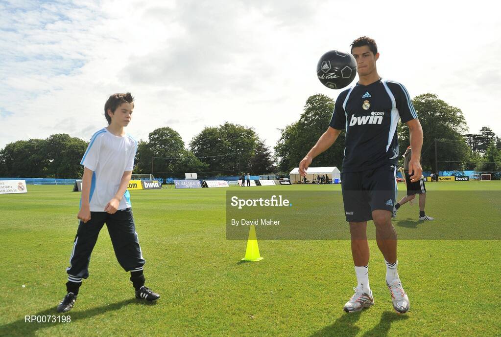 19 July 2009; Real Madrid's Cristiano Ronaldo practices his skills as Andrew Howell watches on during a special training session run by adidas and Lifestyle Sports. Real Madrid pre-season squad training, Carton House, Maynooth, Co. Kildare. Picture credit: David Maher / SPORTSFILE
