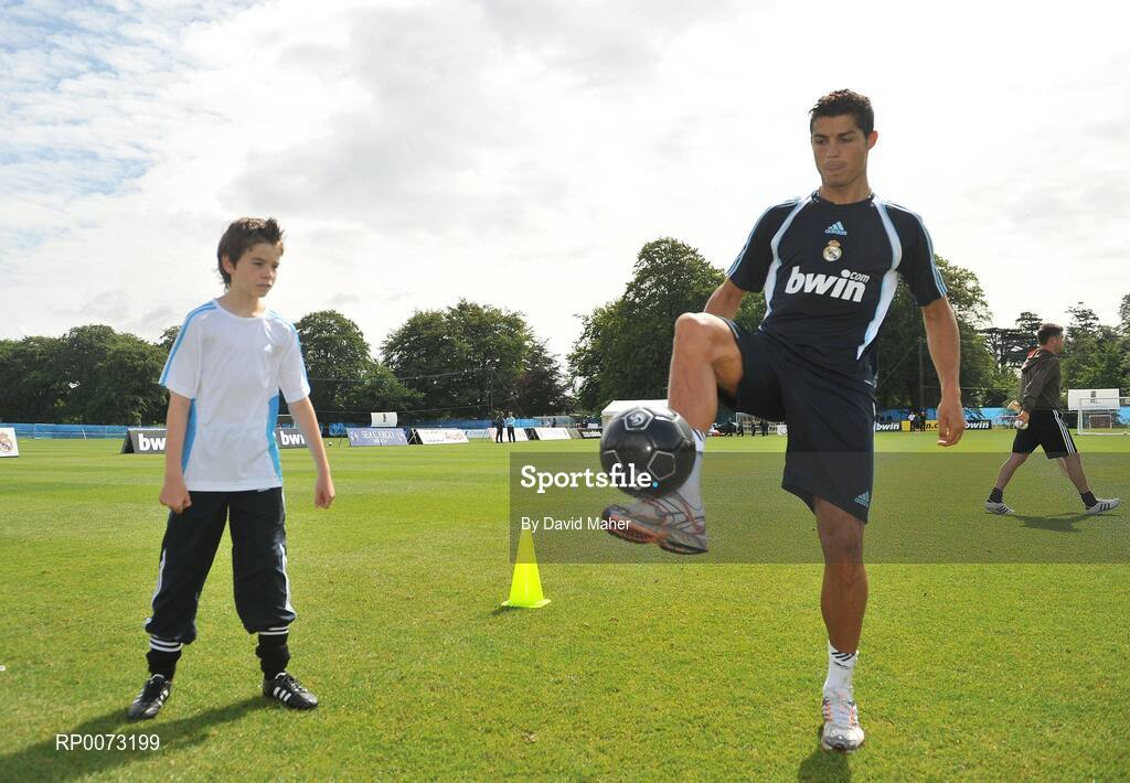 19 July 2009; Real Madrid's Cristiano Ronaldo practices his skills as Andrew Howell watches on during a special training session run by adidas and Lifestyle Sports. Real Madrid pre-season squad training, Carton House, Maynooth, Co. Kildare. Picture credit: David Maher / SPORTSFILE