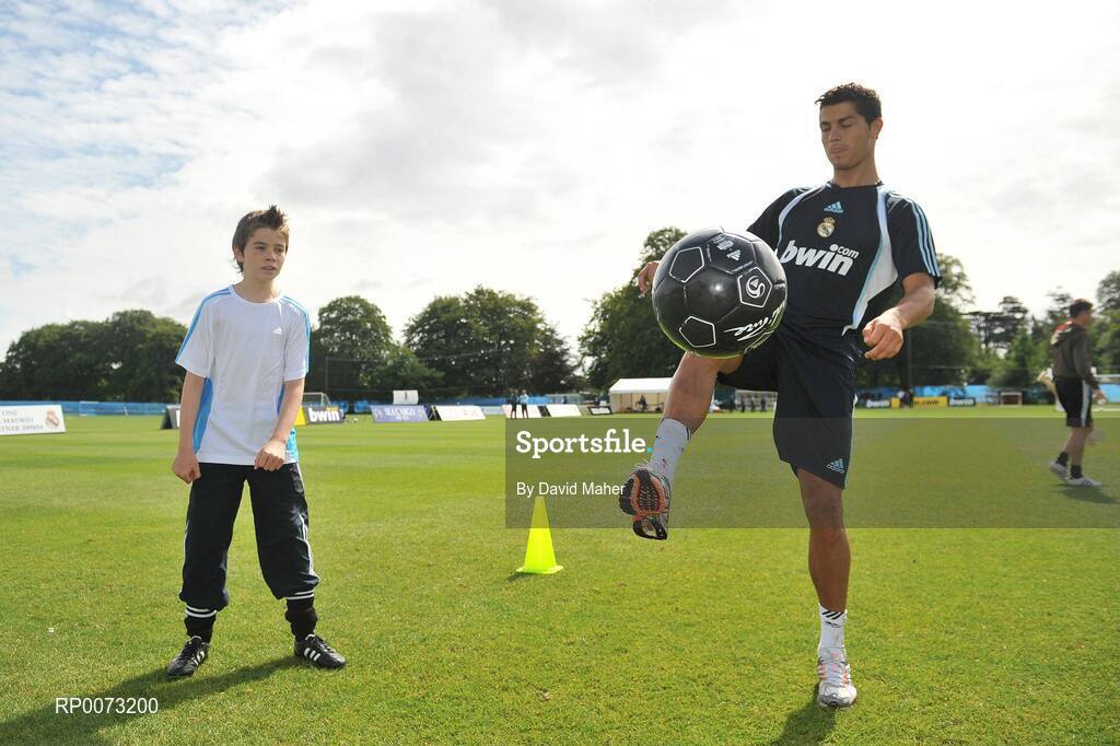 19 July 2009; Real Madrid's Cristiano Ronaldo practices his skills as Andrew Howell watches on during a special training session run by adidas and Lifestyle Sports. Real Madrid pre-season squad training, Carton House, Maynooth, Co. Kildare. Picture credit: David Maher / SPORTSFILE