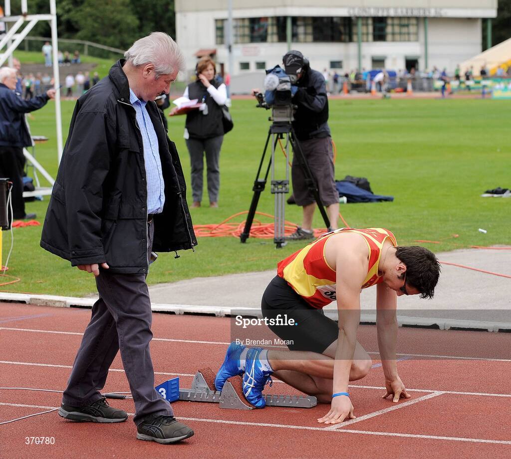 2 August 2009; Race official Christy Wall checks Brian Gregan, Tallaght AC, on the starting blocks in the Men's 400m Final. Woodie's DIY / AAI National Senior Track & Field Championships. Morton Stadium, Santry, Dublin. Picture credit: Brendan Moran / SPORTSFILE