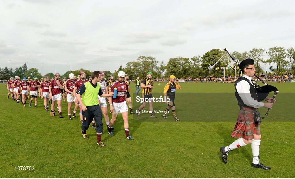 27 September 2015; Piper Eamon Downey leads the Ruairi Og Cushendall and Ballycastle McQuillan teams during the parade. Antrim Senior Championship Hurling Final, Ruairi Og Cushendall v Ballycastle McQuillan, Dunloy GAA Club, Dunloy, Co. Antrim. Picture credit: Oliver McVeigh / SPORTSFILE