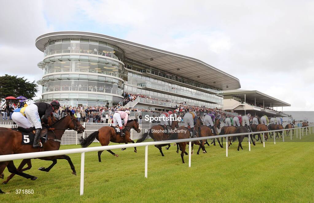27 July 2009; The runners and riders pass grandstand during the Ghotel.ie & Hotelmeyrick.ie Novice Hurdle. Galway Racing Festival, Ballybrit, Galway. Picture credit: Stephen McCarthy / SPORTSFILE