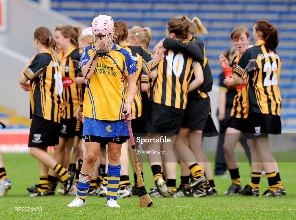 8 August 2009; Clare's Niamh Corry puts her hand to her face as Kilkenny players celebrate in the backround. All-Ireland Camogie Minor A Championship Final, Kilkenny v Clare, Semple Stadium, Thurles, Co. Tipperary. Picture credit: Matt Browne / SPORTSFILE