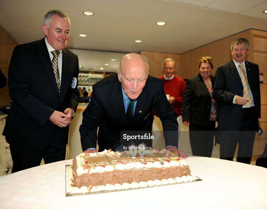 9 August 2009; Former GAA President and Mayo footballer Dr. Mick Loftus blows out the candles in a cake presented to him on the occasion of his 80th birthday as Uachtarán Chumann Lúthchleas Gael Criostóir Ó Cuana , left, and Ard Stiúrthoir Paraic Duffy, right, watch on. Presentation to Dr. Mick Loftus. Croke Park, Dublin. Picture credit: Ray McManus / SPORTSFILE