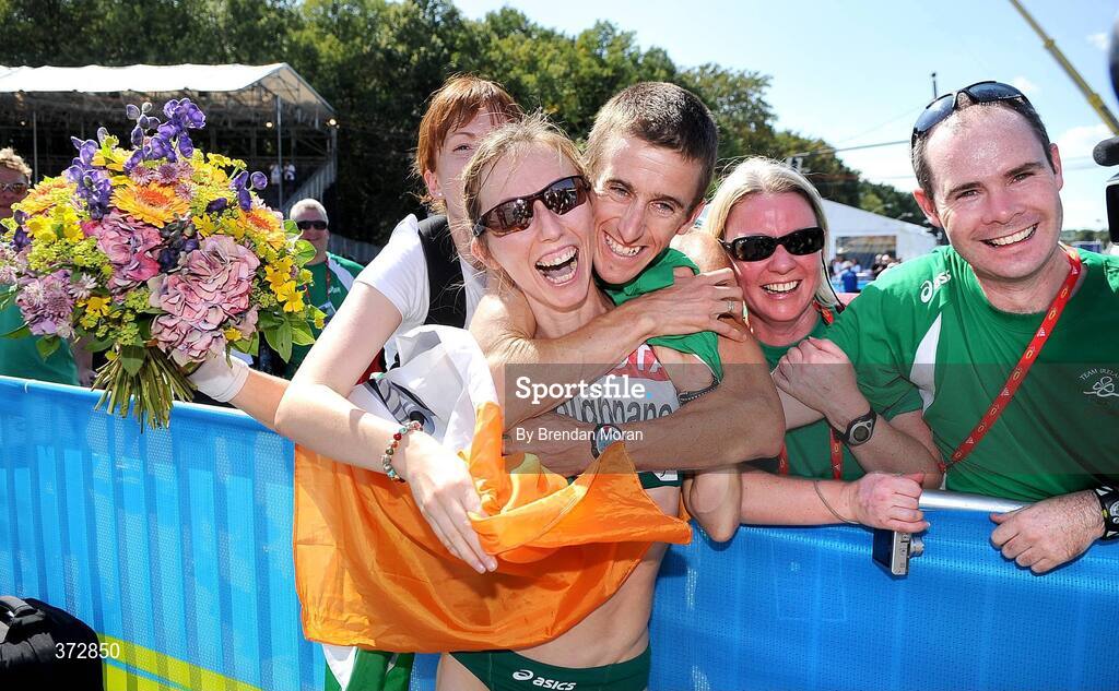 16 August 2009; Ireland's Olive Loughnane is congratulated by, from left, Emma Farrell, Robert Heffernan, Deirdre O'Neill and Pat Ryan after finishing second and winning a silver medal in the Women's 20K Walk Final. 12th IAAF World Championships in Athletics, Berlin, Germany. Picture credit: Brendan Moran  / SPORTSFILE