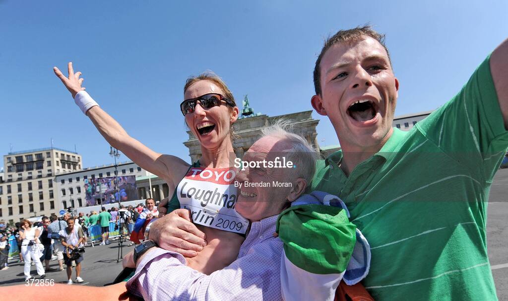 16 August 2009; Ireland's Olive Loughnane is congratulated by her father Matt and brother Brendan after finishing second and winning a silver medal in the Women's 20K Final. 12th IAAF World Championships in Athletics, Berlin, Germany. Picture credit: Brendan Moran  / SPORTSFILE