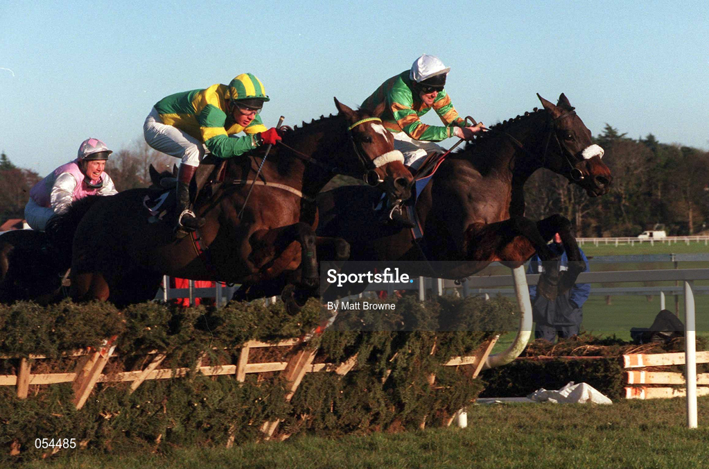 28 December 1999; Oa Baldixe, with Paul Carberry up, left, and Raunchy, with Charlie Swan up, jumps the hurdle during The O'Dwyers Stillorgan Orchard Novice Hurdle at Leopardstown Racecourse in Dublin. Photo by Matt Browne/Sportsfile