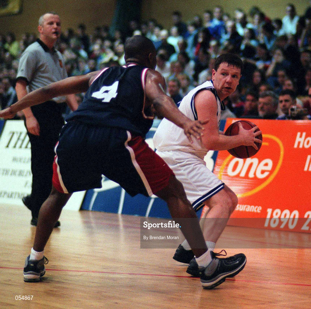 30 January 2000; Mark Keenan of St. Vincents in action against Brian Benjamin of Denny Notre Dame during the Senior Men's Sprite Cup Final between Denny Notre Dame and St Vincent's at the National Basketball Arena in Tallaght, Dublin. Photo by Brendan Moran/Sportsfile
