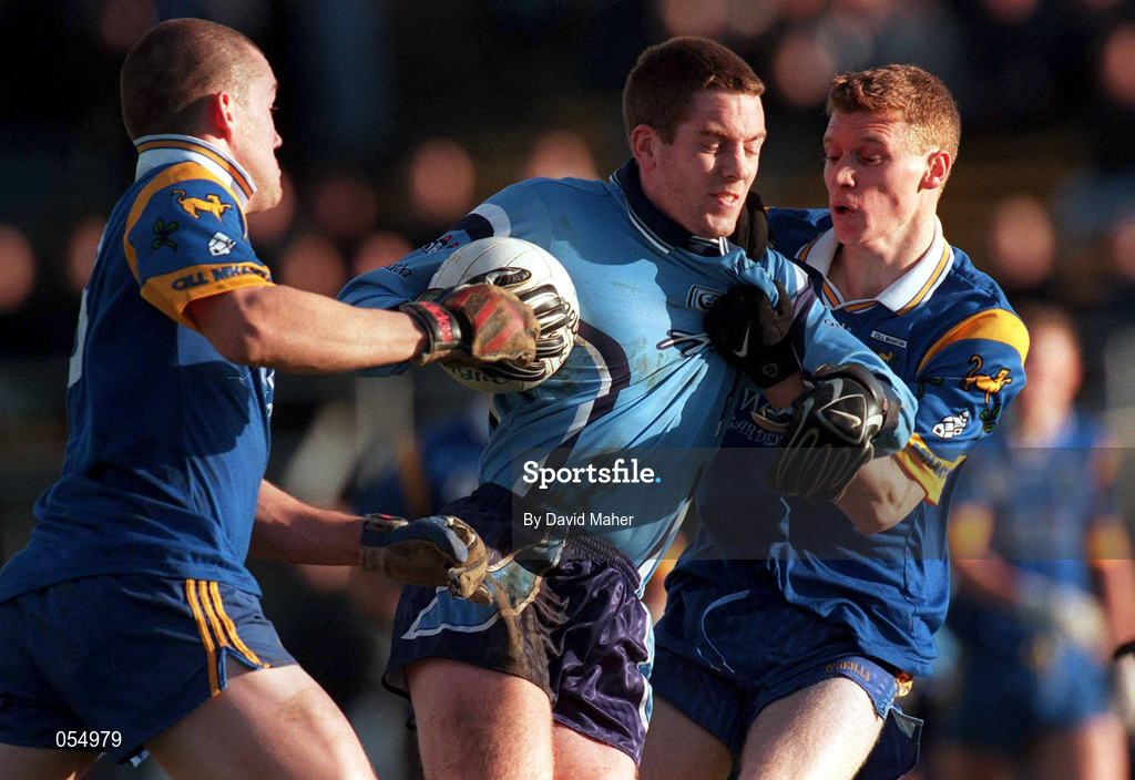 21 January 2001; Kenneth Darcy of Dublin holds off the challange from Gary Doran, left, and Thomas Burke of  Wicklow during the O'Byrne Cup Quarter-Final match between Wicklow and Dublin at the County Grounds in Aughrim, Wicklow. Photo by David Maher/Sportsfile