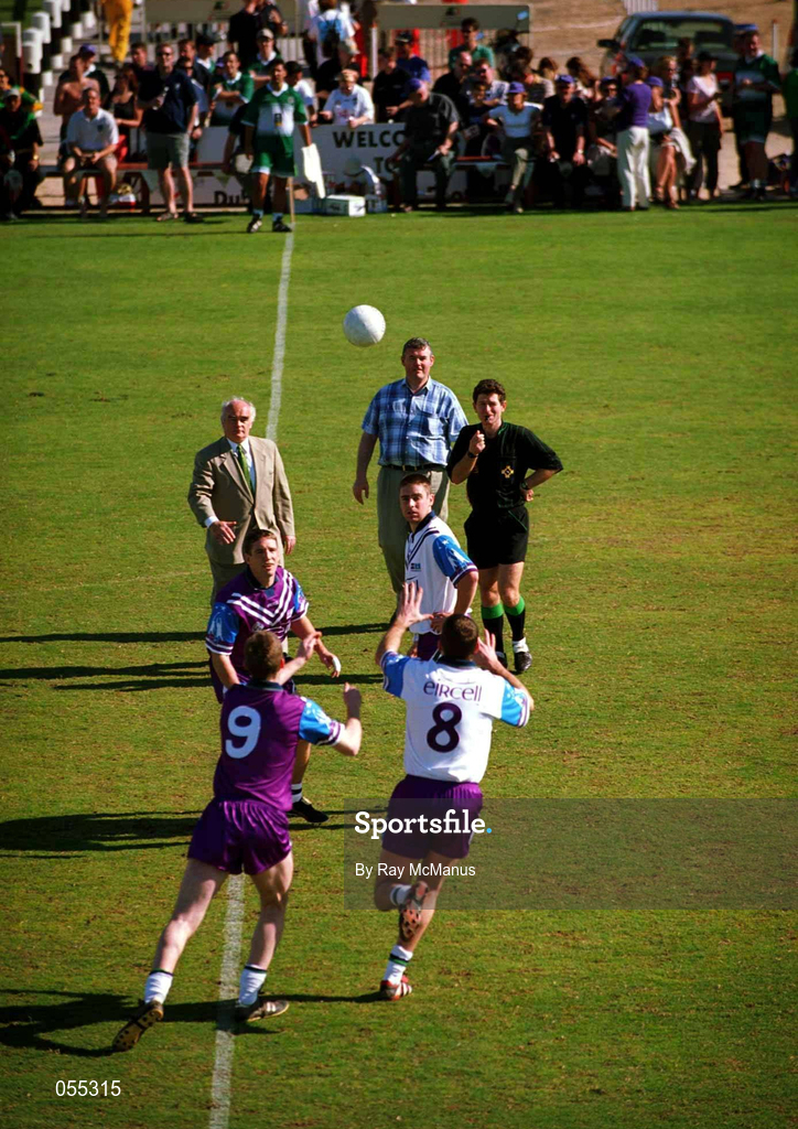 26 January 2001; Ciaran Whelan, 9. and Anthony Tohill, vying for possession after the Irish Ambassador to the region had thrown in the ball during an exhibition match on the Eircell GAA All-Star tour at the Dubai Rugby Ground in Dubai, United Arab Emirates. Photo by Ray McManus/Sportsfile