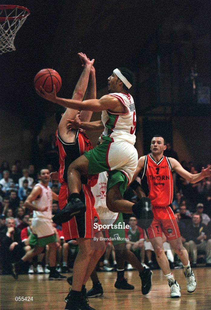 28 January 2001; Bryan Howard of Longnecks Ballina shoots for a basket despite the efforts of John Leahy of  Killester during the ESB Men's Cup Final match between Killester and Longnecks Ballina at the National Basketball Arena in Tallaght, Dublin. Photo by Brendan Moran/Sportsfile