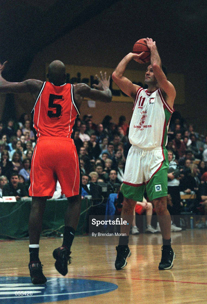 28 January 2001; Liam McHale of Longnecks Ballina shoots for a basket despite the efforts of Eric Jackson of Killester during the ESB Men's Cup Final match between Killester and Longnecks Ballina at the National Basketball Arena in Tallaght, Dublin. Photo by Brendan Moran/Sportsfile