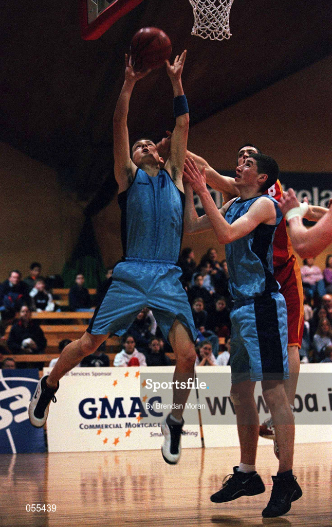 28 January 2001; Ger Noonan of Neptune collects the rebound against Darragh Verschoyle of Big Al's Notre Dame during the Men's U19 Cup Final match between Neptune and Big Al's Notre Dame at the National Basketball Arena in Tallaght, Dublin. Photo by Brendan Moran/Sportsfile