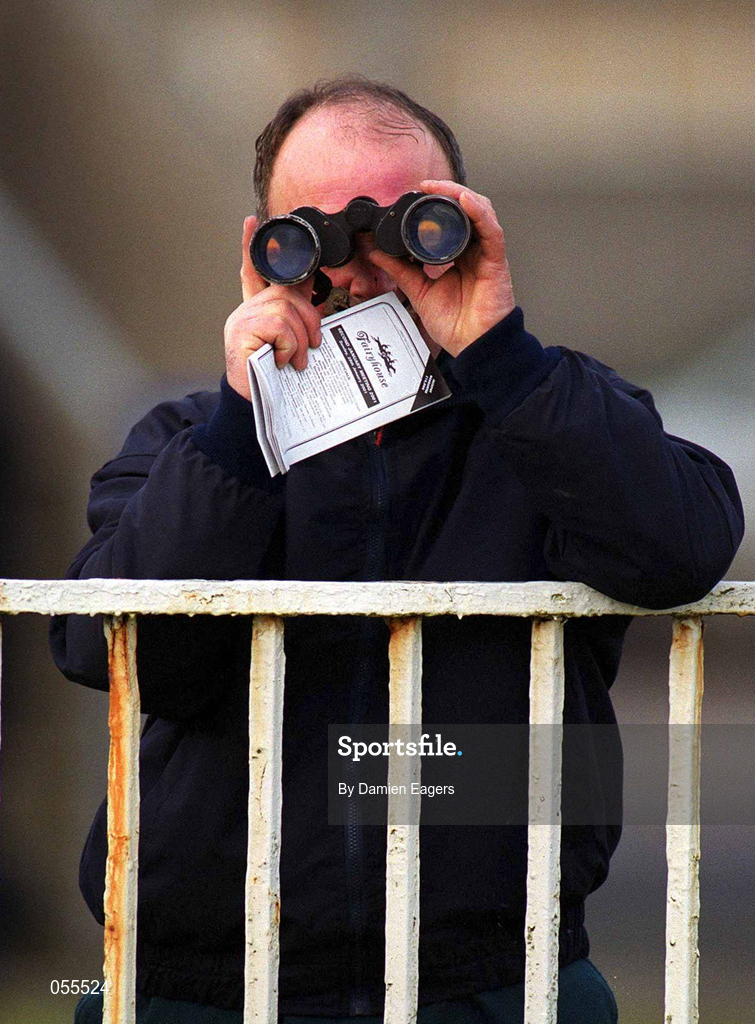 28 January 2001; A racegoer watches racing with his binoculars at Fairyhouse Racecourse in Ratoath, Meath. Photo by Damien Eagers/Sportsfile