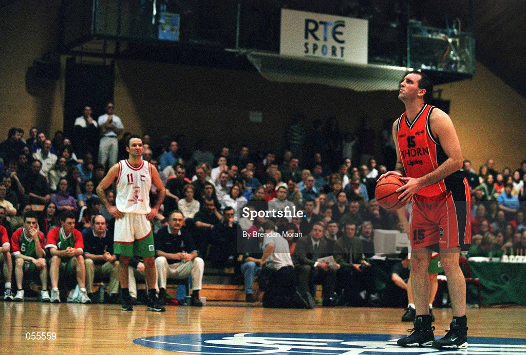 28 January 2001; John Leahy of Killester shoots a free throw watched by the Longnecks Ballina bench during the ESB Men's Cup Final match between Killester and Longnecks Ballina at the National Basketball Arena in Tallaght, Dublin. Photo by Brendan Moran/Sportsfile