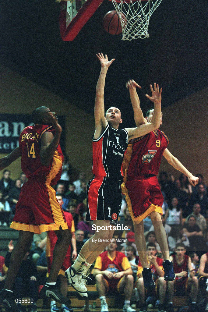 27 January 2001; Damien Sealy of Killester in action against Nuno Silviera, left, and Paul Cummins of Big Al's Notre Dame during the ESB Men's Cup Semi-Final match between Killester and Big Al's Notre Dame at the National Basketball Arena in Tallaght, Dublin. Photo by Brendan Moran/Sportsfile