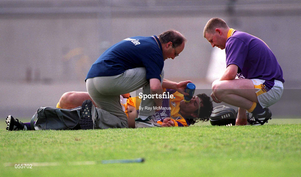 18 June 2000; Wexford team doctor, left, and goalkeeper Damien Fitzhenry, attend to Sean Flood of Wexford, after he received an injury during the Guinness Leinster Senior Hurling Championship semi-final match between Offaly and Wexford at Croke Park in Dublin. Photo by Ray McManus/Sportsfile