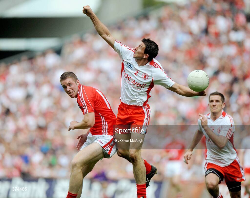23 August 2009; PJ Quinn, Tyrone, in action against Colm O'Neill, Cork. GAA Football All-Ireland Senior Championship Semi-Final, Tyrone v Cork, Croke Park, Dublin. Picture credit: Oliver McVeigh / SPORTSFILE
