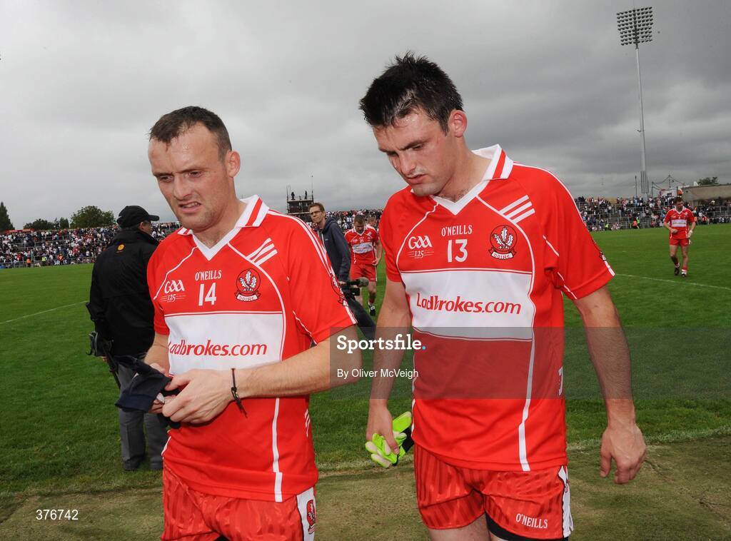 21 June 2009; A dejected Paddy Bradley and Eoin Bradley, Derry, walk off the pitch after the game. GAA Football Ulster Senior Championship Semi-Final, Tyrone v Derry, Casement Park, Belfast, Co. Antrim. Picture credit: Oliver McVeigh / SPORTSFILE