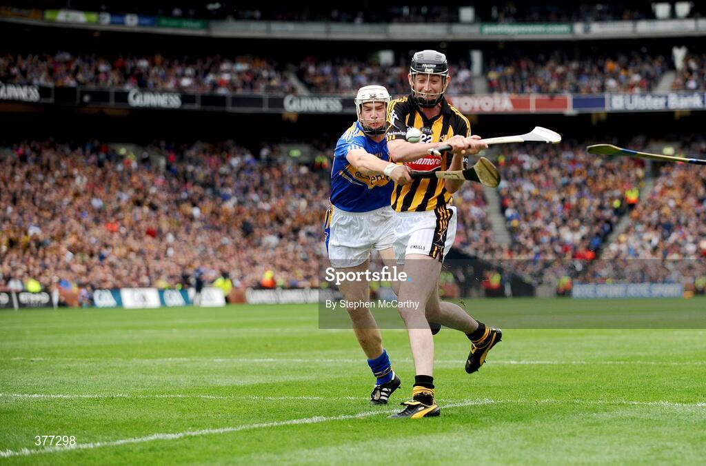 6 September 2009; Martin Comerford, Kilkenny, shoots to score his side's second goal despite the attention of Brendan Maher, Tipperary. GAA Hurling All-Ireland Senior Championship Final, Kilkenny v Tipperary, Croke Park, Dublin. Picture credit: Stephen McCarthy / SPORTSFILE