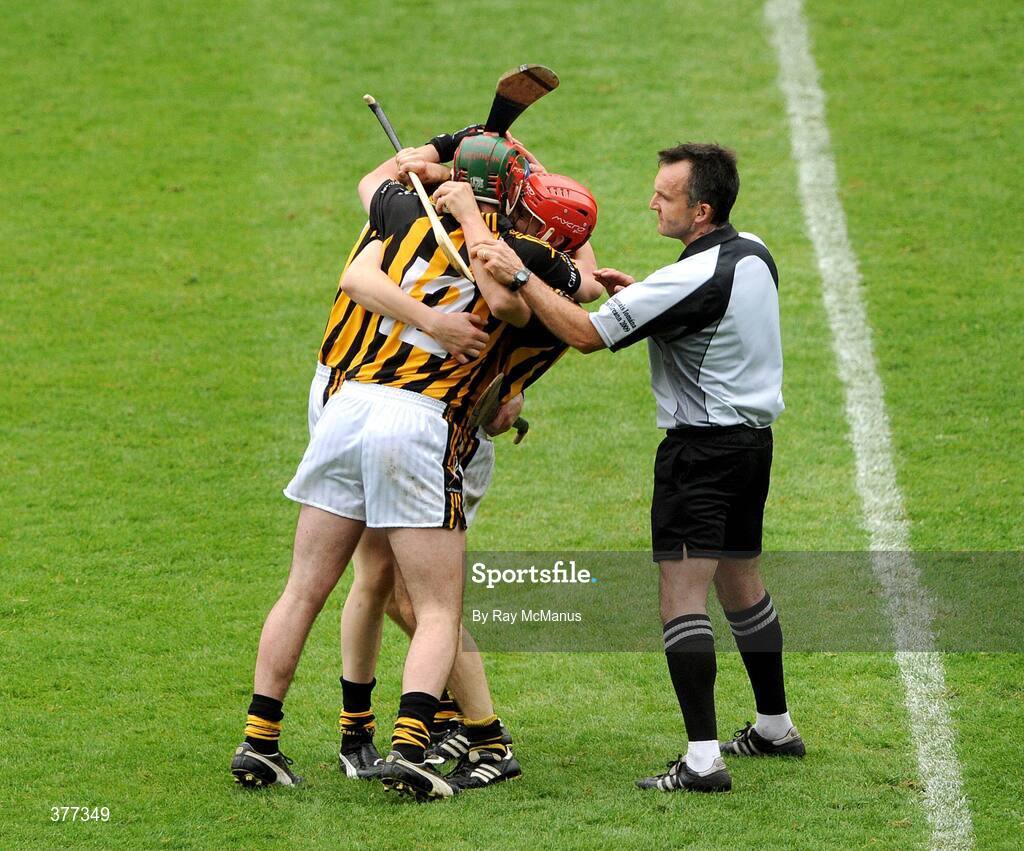 6 September 2009; Referee Diarmuid Kirwan tries to retrieve the sliothar from Tommy Walsh as he celebrates with team-mates Eoin Larkin, 12, and T.J. Reid after the game. GAA Hurling All-Ireland Senior Championship Final, Kilkenny v Tipperary, Croke Park, Dublin. Picture credit: Ray McManus / SPORTSFILE