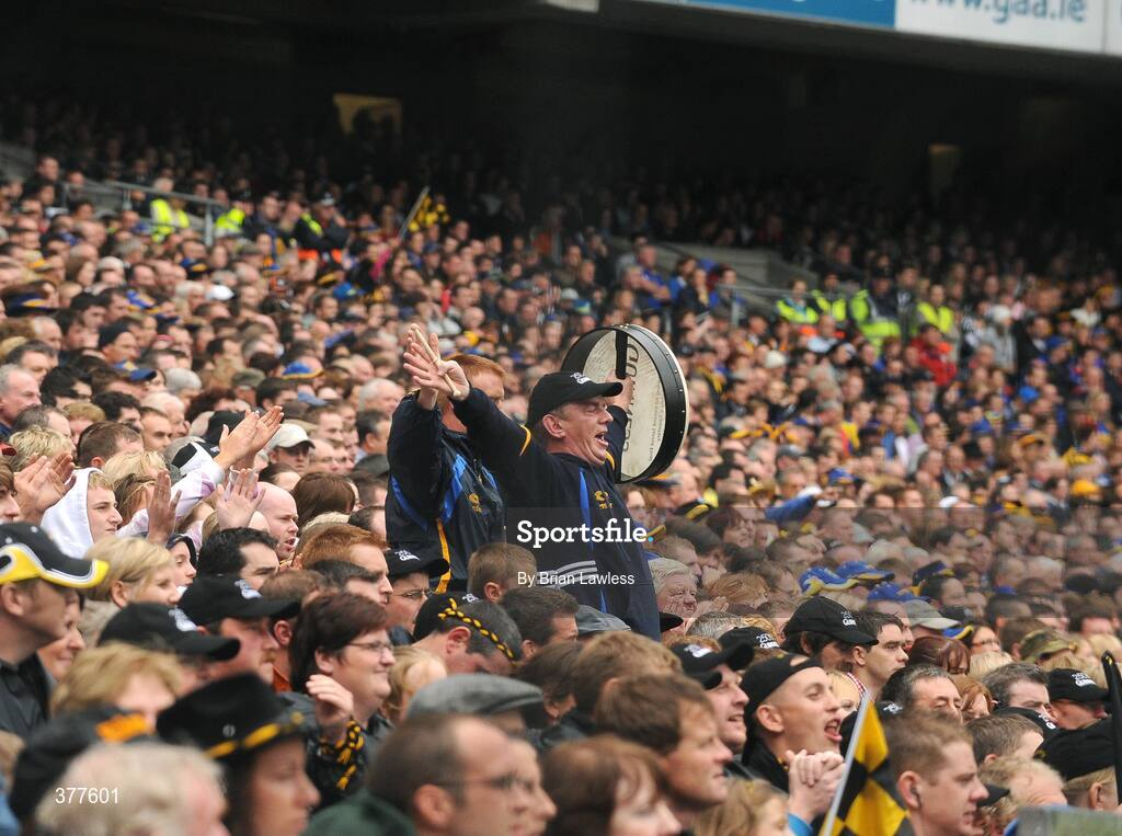 6 September 2009; A Tipperary fan celebrates a score. GAA Hurling All-Ireland Senior Championship Final, Kilkenny v Tipperary, Croke Park, Dublin. Picture credit: Brian Lawless / SPORTSFILE