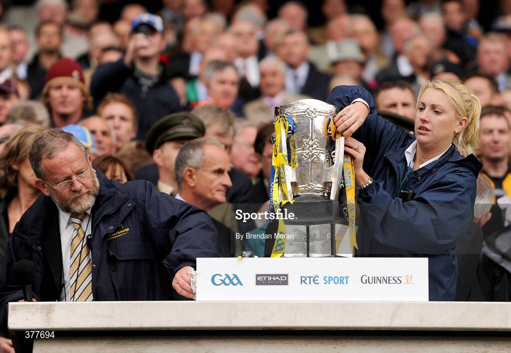 6 September 2009; Presentation stewards Jerry Grogan, left, and Niamh Cullen make the final adjustments before the presentation of the Liam MacCarthy cup to the victorious Kilkenny captain Michael Fennelly. GAA Hurling All-Ireland Senior Championship Final, Kilkenny v Tipperary, Croke Park, Dublin. Picture credit: Brendan Moran / SPORTSFILE